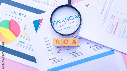Wooden cube with the word ROA. It is an abbreviation of Return on Assets. Business profitability success growth profitability analytics. Business and financial market concept.