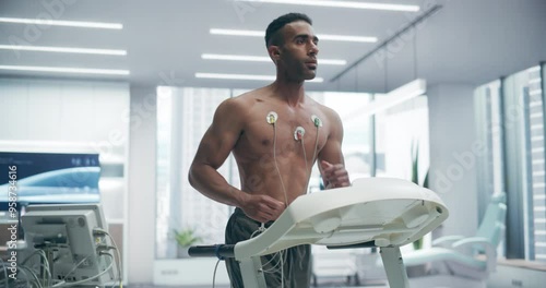 Athlete Performs Treadmill Exercise Test in a High-tech Medical Lab, Monitored by Sensors, Showcasing Advanced Fitness Evaluation and Health Monitoring photo