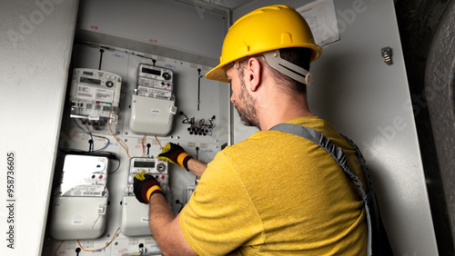 Obraz na płótnie Technician working on a modern electricity power meter station in a building. w salonie