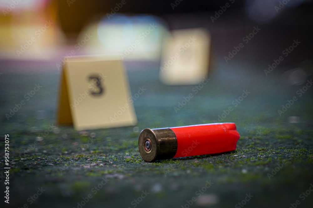 Bullet casings fall on cement floor and blurred background of evidence ...