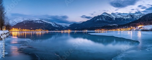 Frozen Lake with Snowy Mountain Range at Dusk