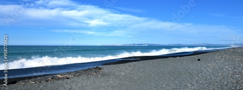 Long crashing waves on to the steep stoney beach of Napier