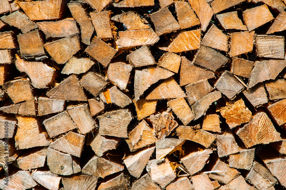 a stack of chopped firewood in alps a stack of chopped firewood in alps