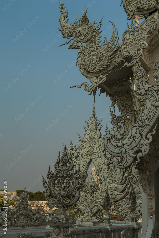 Fototapeta premium Chiang Rai, Thailand - March 2020: Part of the exterior of White temple or Wat Rong Khun. Details