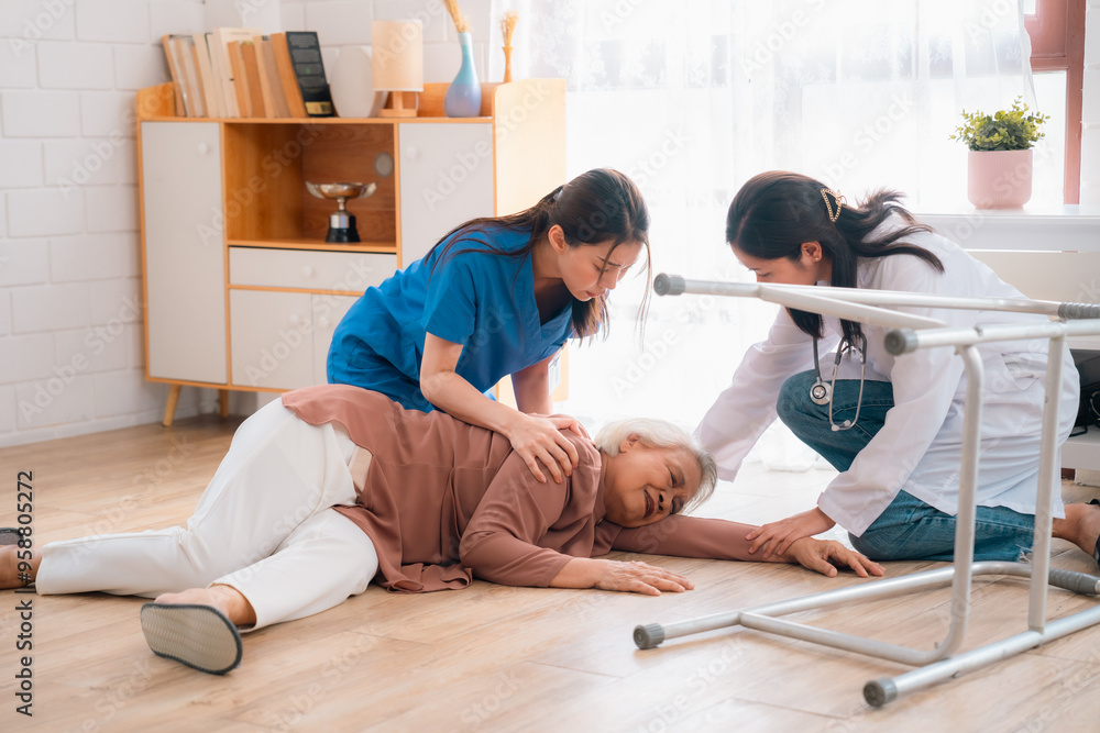 Obraz premium senior patient falling on the ground floor at home, Asian caregiver helping elderly older female from accident after doing physical therapy then rescued by attractive therapist nurse, health insurance