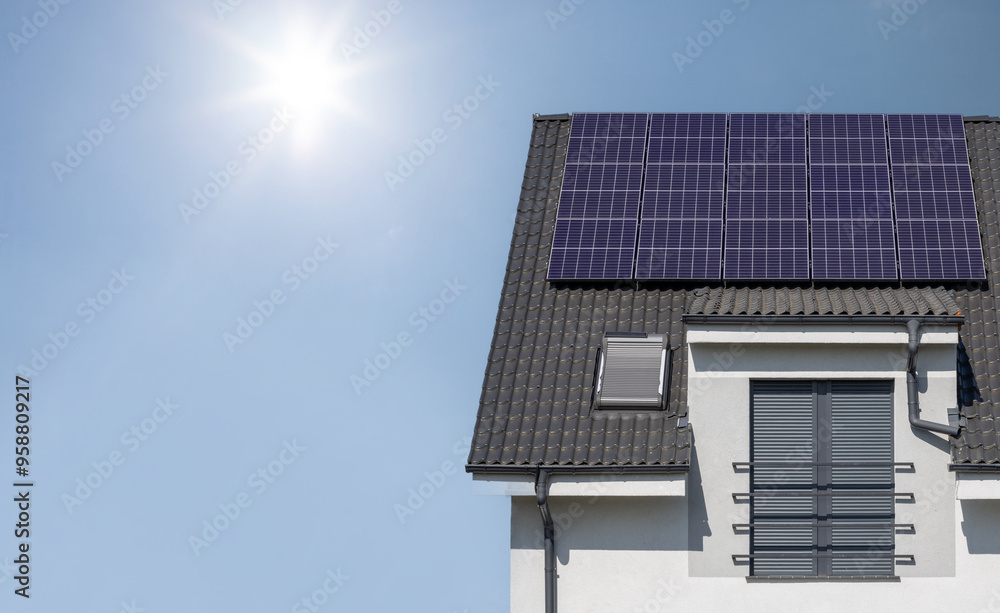 Fototapeta premium Solar Panels on House Roof in Sunlight