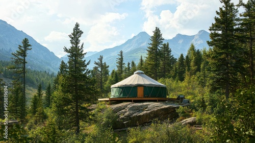 Fototapeta Naklejka Na Ścianę i Meble -  A distant view of a yurt nestled among trees or mountains, emphasizing its location within nature.