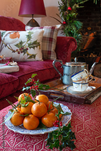 Christmas scene with oranges and tea on a coffee table