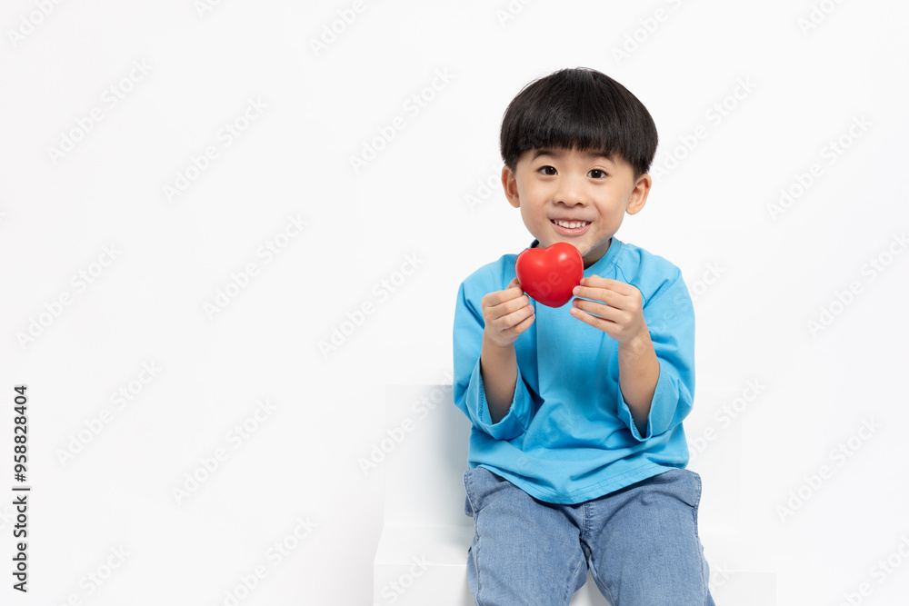 Happy Asian little boy showing red heart isolated on white background, five years old Happy Asian little boy showing red heart isolated on white background, five years old