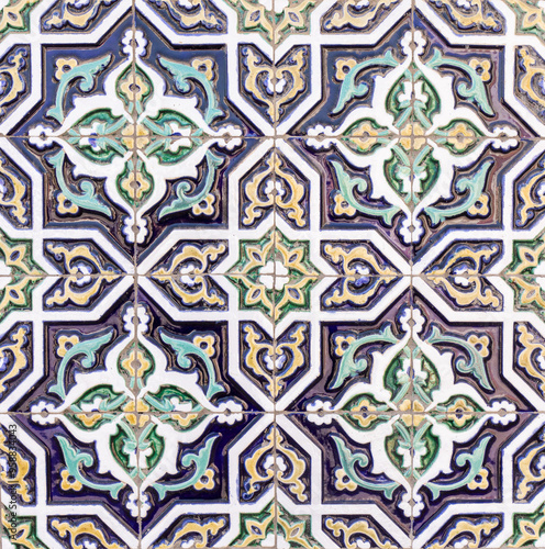 ceramic Uzbek mosaic with green, blue and yellow traditional oriental Arabic Islamic pattern decorated with ornament background