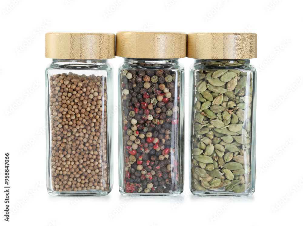 Different spices in glass jars isolated on white Different spices in glass jars isolated on white