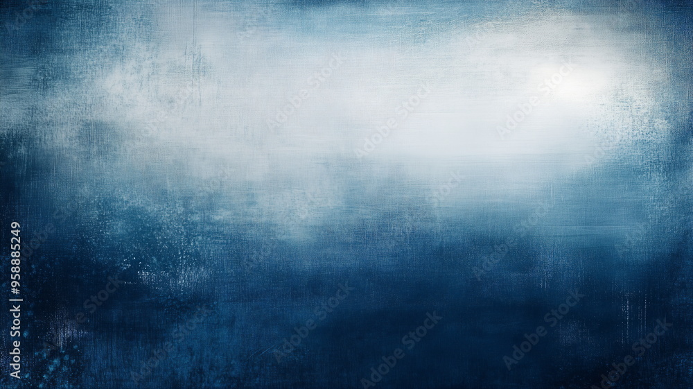Obraz premium A textured dreamy background of dark blue merging with soft, misty whites