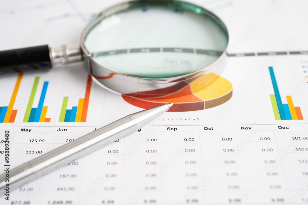 Magnifying glass on graph. Finance business and trading. Magnifying glass on graph. Finance business and trading.
