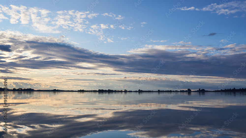 Fototapeta premium Beautiful clouds in a lagoon with the sunset Horizontal