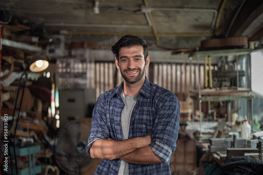 Portrait of guitar luthier small business owner in workroom Portrait of guitar luthier small business owner in workroom