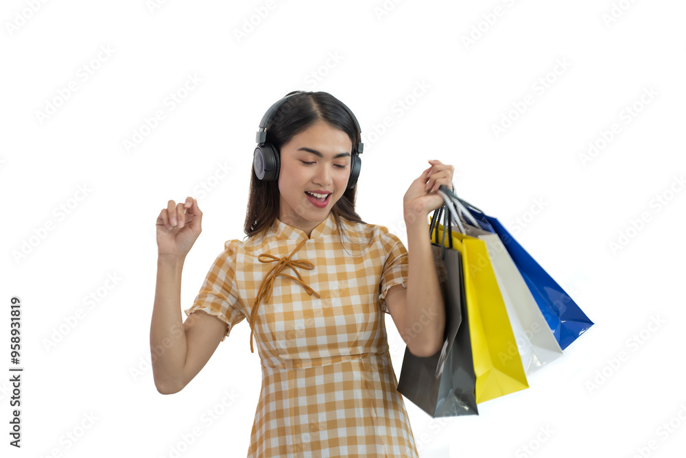 Happy Asian woman holding shopping bags isolated on white background Happy Asian woman holding shopping bags isolated on white background