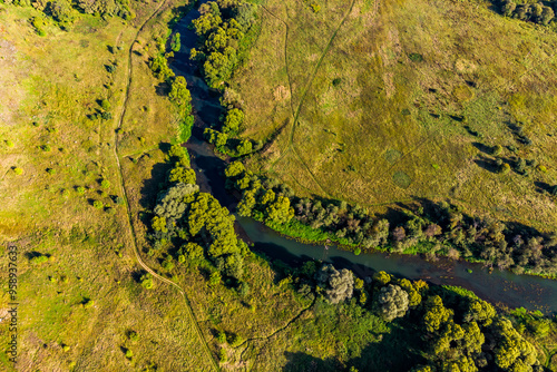 Small river Luzha flowing in Maloyaroslavetsky district, Kaluga region, aerial view photo