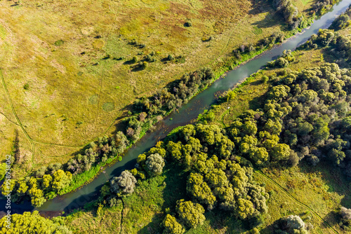 Small river Luzha flowing in Maloyaroslavetsky district, Kaluga region, aerial view photo