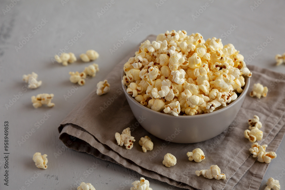 Homemade Salty Popcorn in a Bowl, side view. Homemade Salty Popcorn in a Bowl, side view.