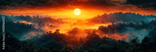 A fiery sunset casts an orange glow over a misty jungle landscape.