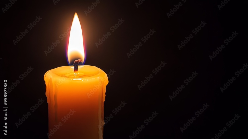 A close-up of a lit candle with a warm glow against a dark background, creating a soothing atmosphere. A close-up of a lit candle with a warm glow against a dark background, creating a soothing atmosphere.