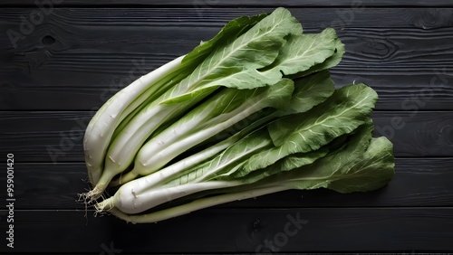 Celtuce on black wood table photo