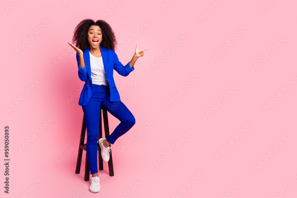 Photo of cheerful glad nice lovely girl wear trendy blue clothes sit wooden chair empty space isolated on pink color background Photo of cheerful glad nice lovely girl wear trendy blue clothes sit wooden chair empty space isolated on pink color background