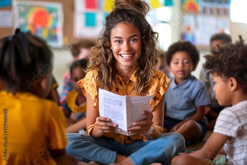 A female teacher reads to students sitting on the floor in a classroom