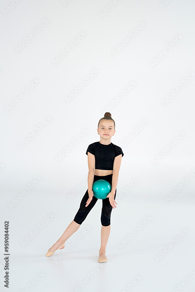 rhythmic gymnast performing with ball, showing skills and stay isolated on white background. Concept of sport, active lifestyle, hobby. rhythmic gymnast performing with ball, showing skills and stay isolated on white background. Concept of sport, active lifestyle, hobby.