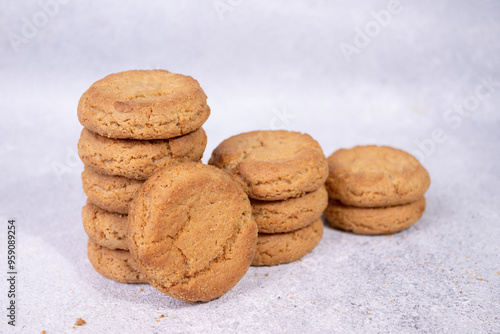 stacks of homemade oatmeal cookies on a white background