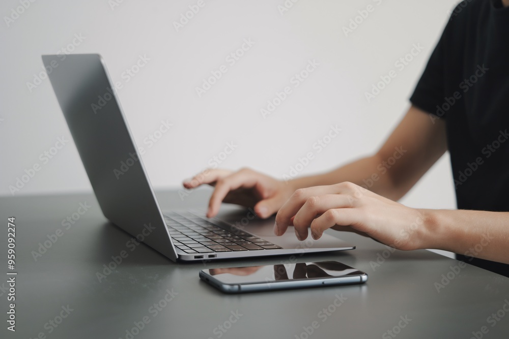 Focused Flow: Hands dance across a sleek laptop keyboard, embodying productivity in a minimalist workspace. Focused Flow: Hands dance across a sleek laptop keyboard, embodying productivity in a minimalist workspace.