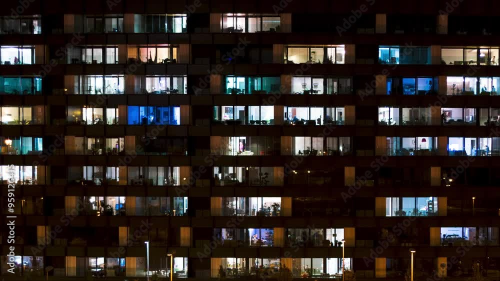 Nighttime time-lapse of a close-up view of building windows. Ideal for projects focused on urban life, cityscapes, and modern living. Nighttime time-lapse of a close-up view of building windows. Ideal for projects focused on urban life, cityscapes, and modern living.