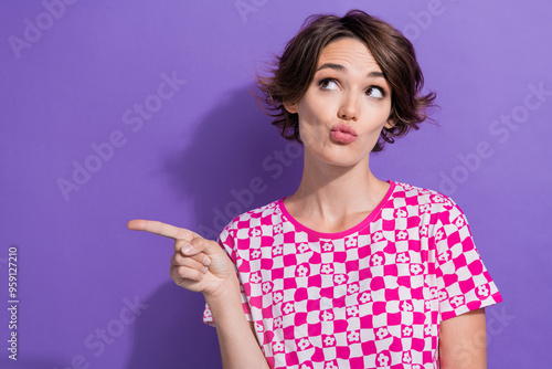 Photo of minded cute girl wear pink trendy clothes look up empty space suspicious offer news hmm isolated on purple color background