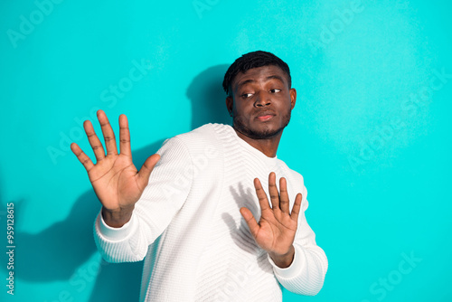 Photo portrait of attractive young man stop gesture avoid dressed stylish white clothes isolated on cyan color background