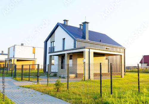 Villa in village. Modern Architect-designed luxury house. Wooden Scandi home in country. Modern family house Project. Contemporary design a suburb house. Villa Design. Euro fence of Sustainable house.