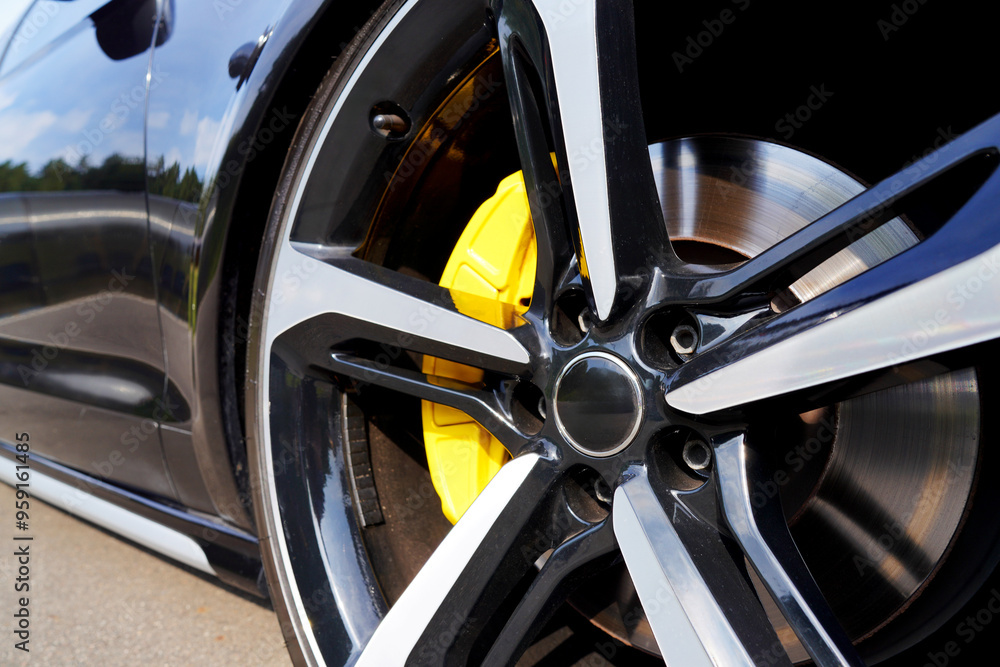 Alloy wheel with calipers and racing brakes of the sport car. Racing brake disc and low profile tyres. Race car test driving. Lower-profile tires of drag and drift cars. High-performance sports cars. Alloy wheel with calipers and racing brakes of the sport car. Racing brake disc and low profile tyres. Race car test driving. Lower-profile tires of drag and drift cars. High-performance sports cars.