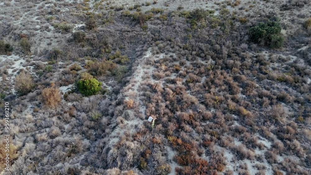 Aerial Flight. Drone cinematic shot Cyclist rides along mountain ridge, enjoying view and challenge. Aerial view of beautiful mountain landscape Aerial Flight. Drone cinematic shot Cyclist rides along mountain ridge, enjoying view and challenge. Aerial view of beautiful mountain landscape