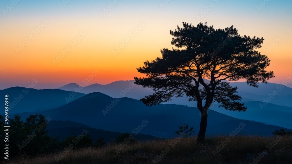As day closes, a stunning sunset paints the sky with warm hues above the mountains, highlighting a proud tree, encapsulating the tranquility of the evening and inviting reflection on natures beauty As day closes, a stunning sunset paints the sky with warm hues above the mountains, highlighting a proud tree, encapsulating the tranquility of the evening and inviting reflection on natures beauty