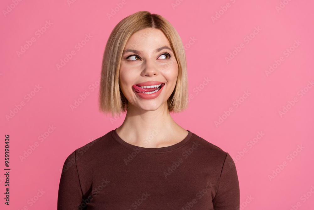 Obraz premium Photo of lovely dreamy cute girl wear trendy brown clothes lick teeth empty space isolated on pink color background