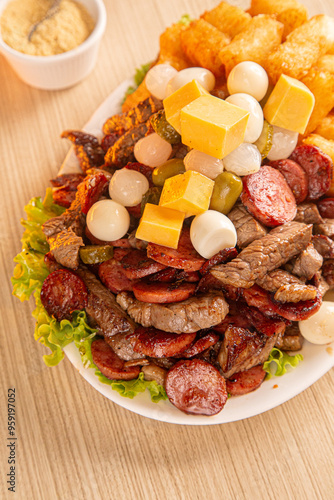 dish with onion, quail egg, pepperoni and cheese, meat
