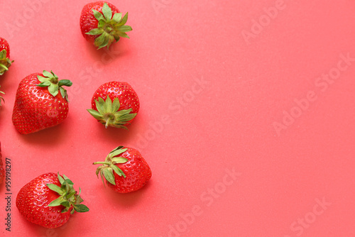 Fresh strawberries on red background