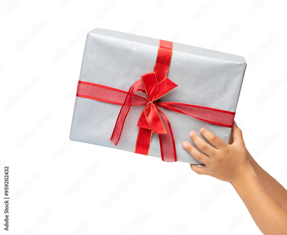 Hand of child holding gift box over white background. Hand of child holding gift box over white background.