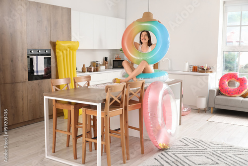 Young woman with swim rings...