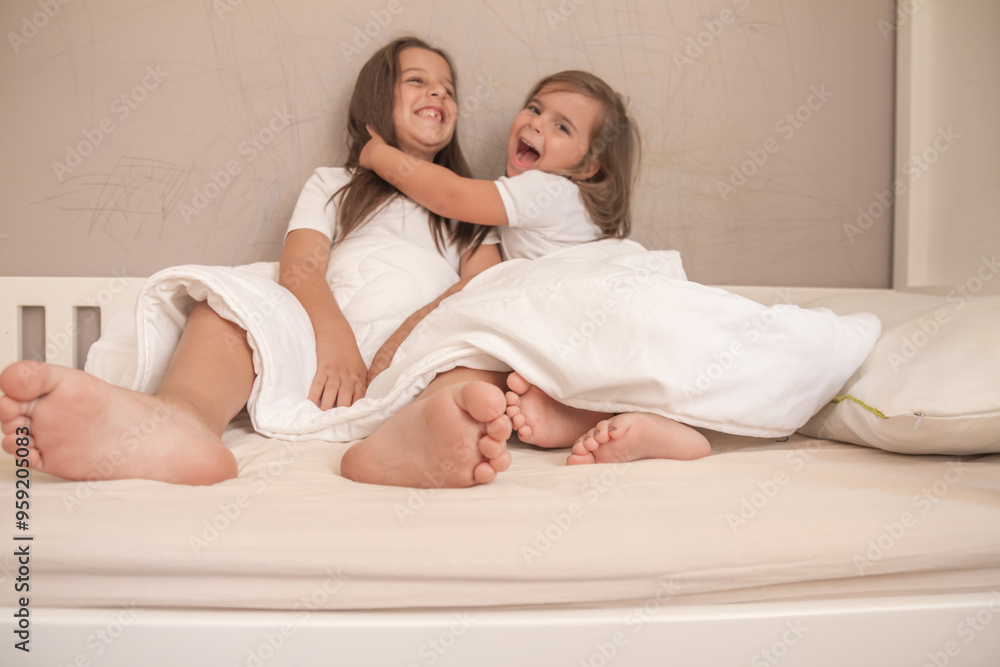 little girls playing in their room and tickling and hugging each other little girls playing in their room and tickling and hugging each other
