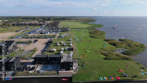 Svencele Village on the Bank of the Curonian Lagoon, Lithuania Water Sport Recreation Area, Kitesurfing, Windsurfing, Kayak, Wakeboarding Aerial Shot. Svencele Dune New Development Residential Buildin photo