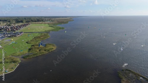 Svencele Village on the Bank of the Curonian Lagoon, Lithuania Water Sport Recreation Area, Kitesurfing, Windsurfing, Kayak, Wakeboarding Aerial Shot. Svencele Dune New Development Residential Buildin photo