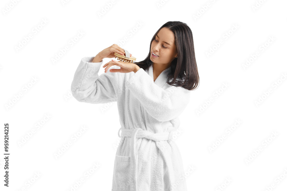 Young woman in bathrobe massaging arm on white background Young woman in bathrobe massaging arm on white background