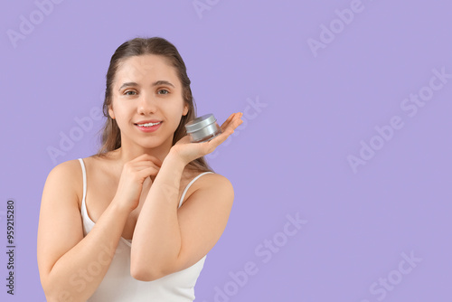 Young woman with jar of fac...