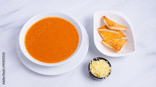 Tomato soup bowl with crackers