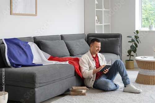 Young man with flag of Fran...